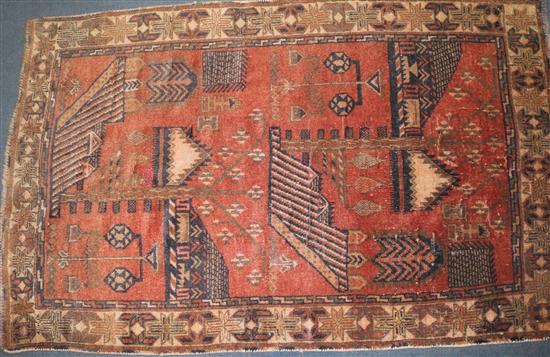 A Caucasian red ground Tree of Life rug, 4ft 6in by 2ft 11in.